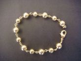 Pulseira de Bola Dourada