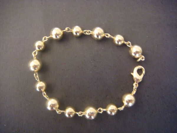 Pulseira de Bola Dourada
